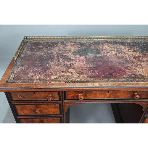 903 - A Victorian Aesthetic period ebonised and walnut pedestal desk, the tooled leather inset top with br... 