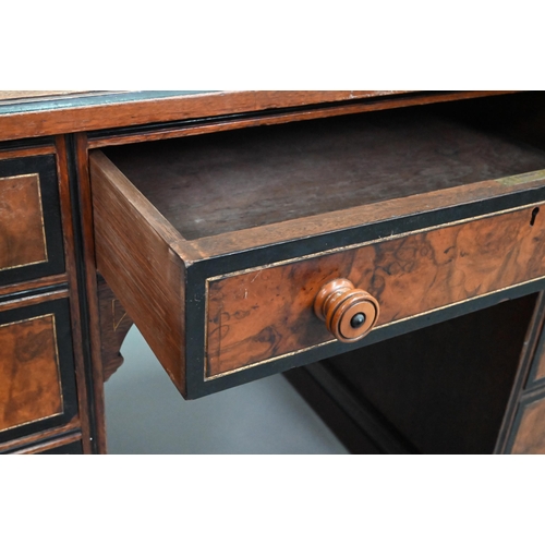 903 - A Victorian Aesthetic period ebonised and walnut pedestal desk, the tooled leather inset top with br... 