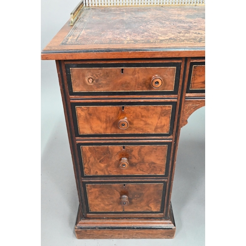 903 - A Victorian Aesthetic period ebonised and walnut pedestal desk, the tooled leather inset top with br... 