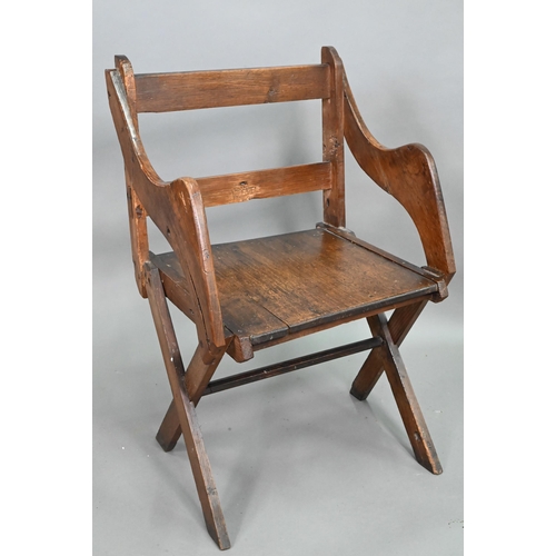 907 - An antique Glastonbury style oak chair