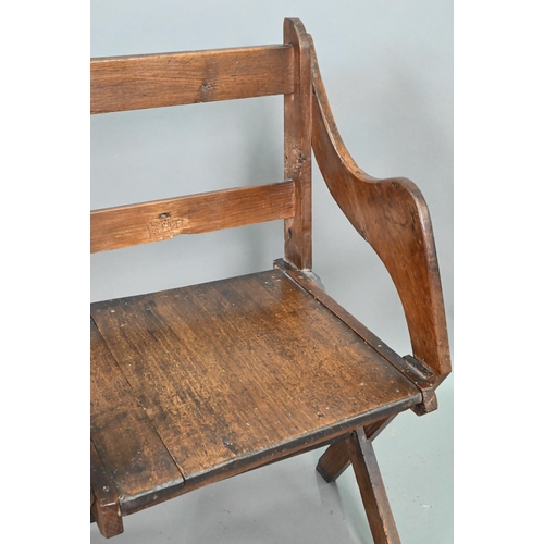 907 - An antique Glastonbury style oak chair