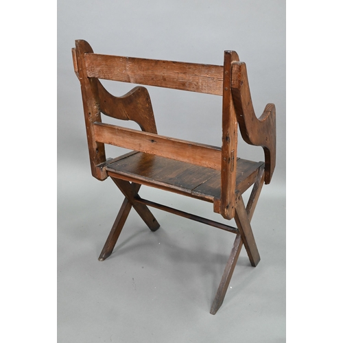 907 - An antique Glastonbury style oak chair