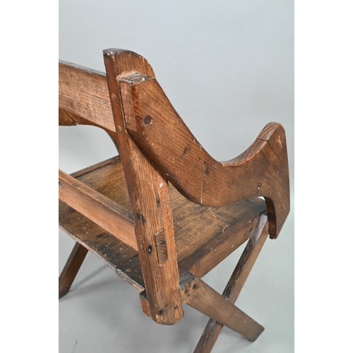 907 - An antique Glastonbury style oak chair