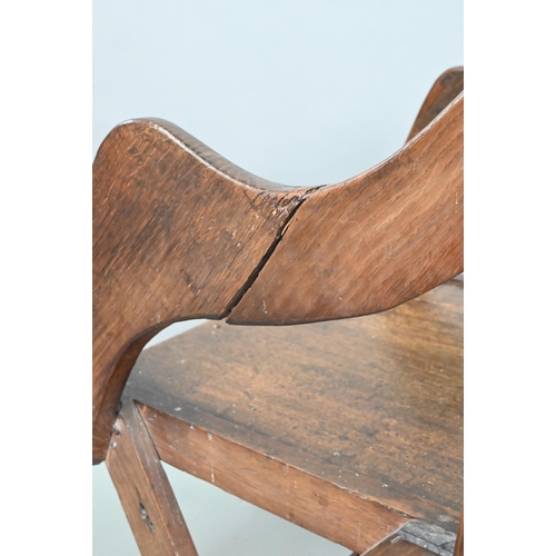 907 - An antique Glastonbury style oak chair