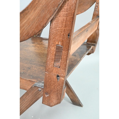 907 - An antique Glastonbury style oak chair