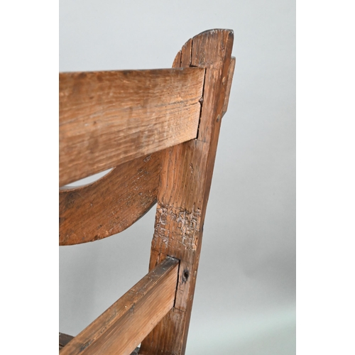 907 - An antique Glastonbury style oak chair