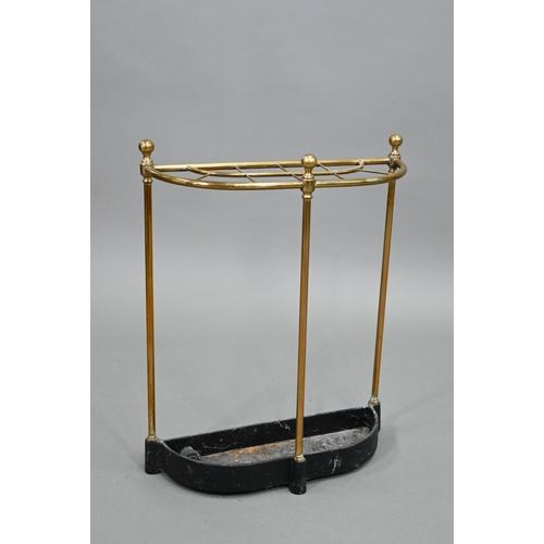 908 - An old open brass framed ten division stick stand, of demi-lune form with cast iron drip tray, 48 cm... 