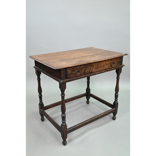 910 - An 18th century oak side table with single drawer, raised on a turned frame united by all-round stre... 