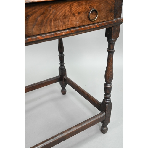 910 - An 18th century oak side table with single drawer, raised on a turned frame united by all-round stre... 