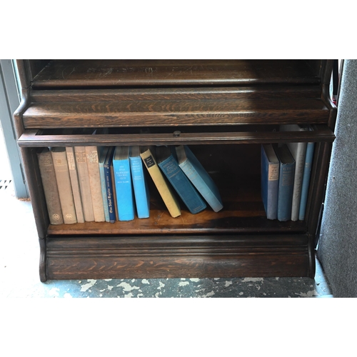 912 - An oak five section Globe Wernicke style library bookcase, raised on a plinth base (faults) 87 cm w ... 