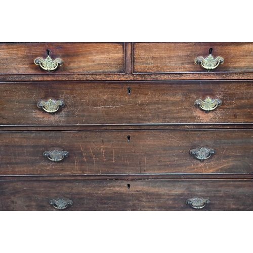 914 - A Georgian mahogany chest of two short over three long graduated drawers, with brass fittings, on sh... 