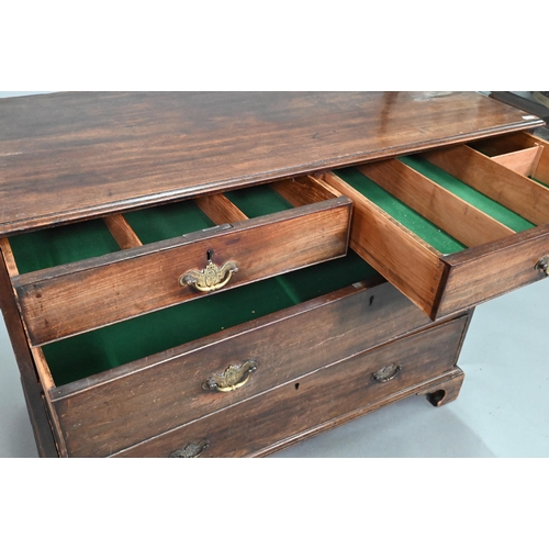 914 - A Georgian mahogany chest of two short over three long graduated drawers, with brass fittings, on sh... 