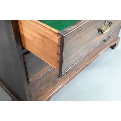 914 - A Georgian mahogany chest of two short over three long graduated drawers, with brass fittings, on sh... 