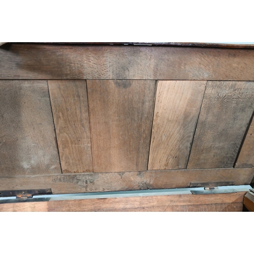 915 - An 18th century and later composed oak and elm chest, the hinged top over three long graduated drawe... 