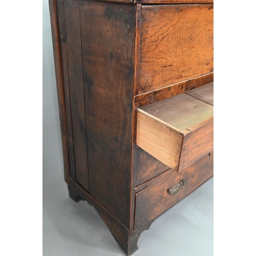 915 - An 18th century and later composed oak and elm chest, the hinged top over three long graduated drawe... 