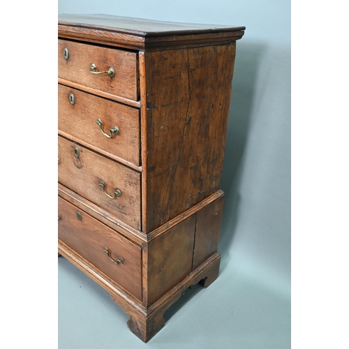 916 - An 18th century oak chest on stand, of diminutive proportions comprising three long graduated drawer... 