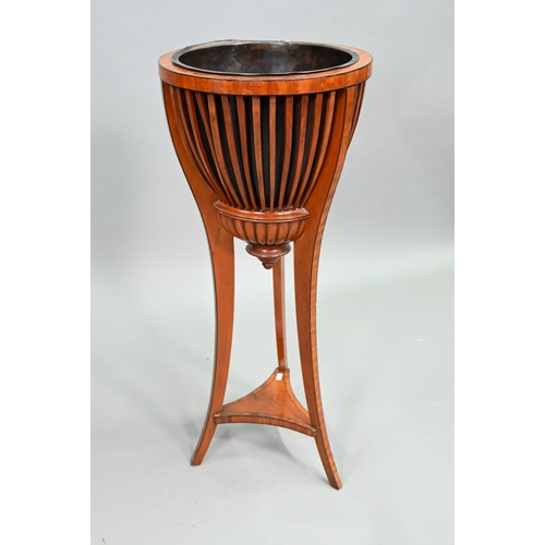 917 - An antique satinwood jardinière stand with brass liner and slatted sides, raised on slender t... 