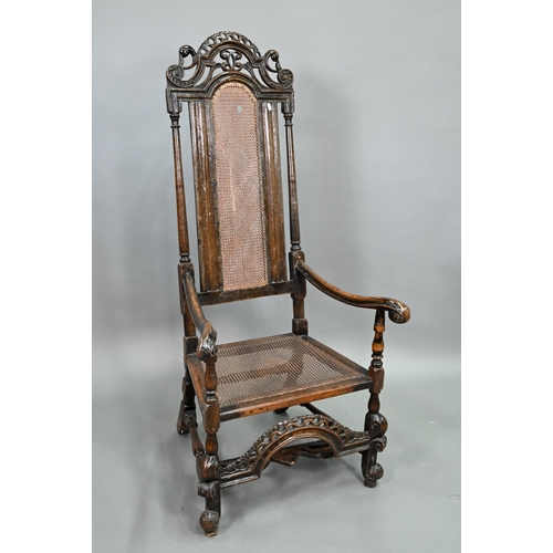 926 - A William & Mary oak framed cane panelled armchair, with moulded frame, scroll arm ends and fron... 