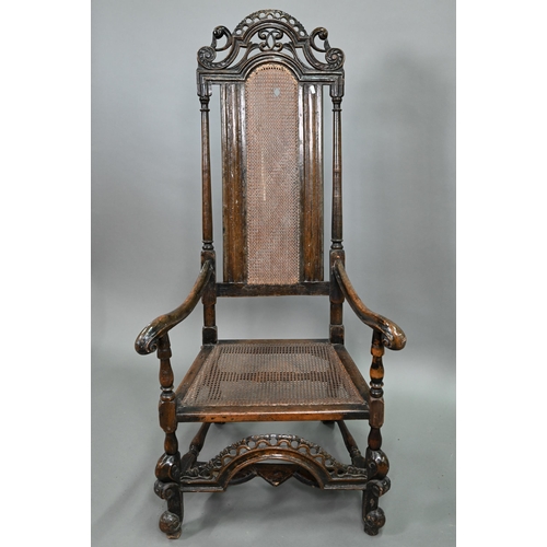 926 - A William & Mary oak framed cane panelled armchair, with moulded frame, scroll arm ends and fron... 