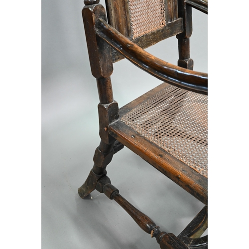 926 - A William & Mary oak framed cane panelled armchair, with moulded frame, scroll arm ends and fron... 