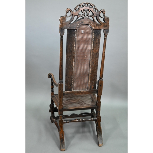 926 - A William & Mary oak framed cane panelled armchair, with moulded frame, scroll arm ends and fron... 