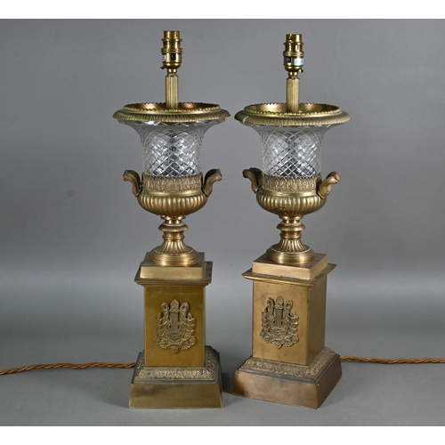 927 - A pair of gilt metal mounted cut glass table lamps, with applied lyre tablets by Tindle Lighting, Lo... 