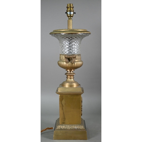 927 - A pair of gilt metal mounted cut glass table lamps, with applied lyre tablets by Tindle Lighting, Lo... 