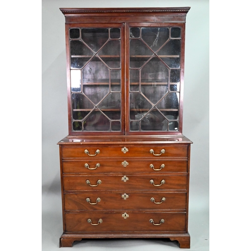 928 - A George III mahogany secretaire bookcase, the dentil moulded cornice over a pair of astragal glazed... 