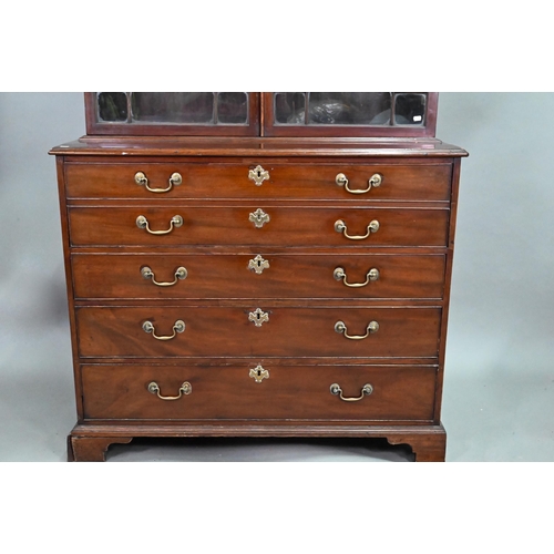 928 - A George III mahogany secretaire bookcase, the dentil moulded cornice over a pair of astragal glazed... 