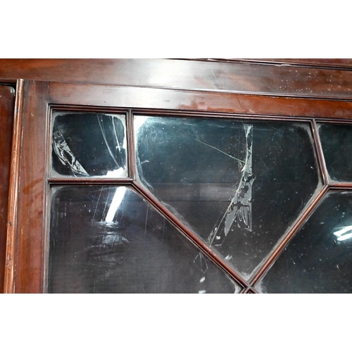 928 - A George III mahogany secretaire bookcase, the dentil moulded cornice over a pair of astragal glazed... 