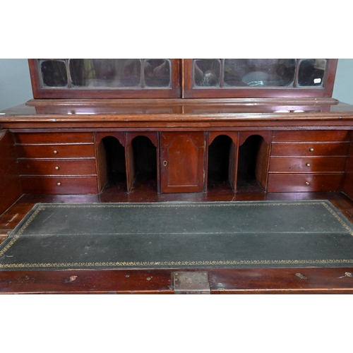 928 - A George III mahogany secretaire bookcase, the dentil moulded cornice over a pair of astragal glazed... 