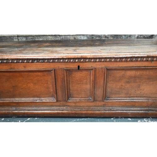 935 - A late 17th/18th century Italian walnut cassone, the staple hinged top with carved frieze band, over... 