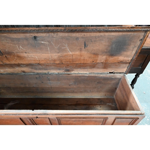 935 - A late 17th/18th century Italian walnut cassone, the staple hinged top with carved frieze band, over... 