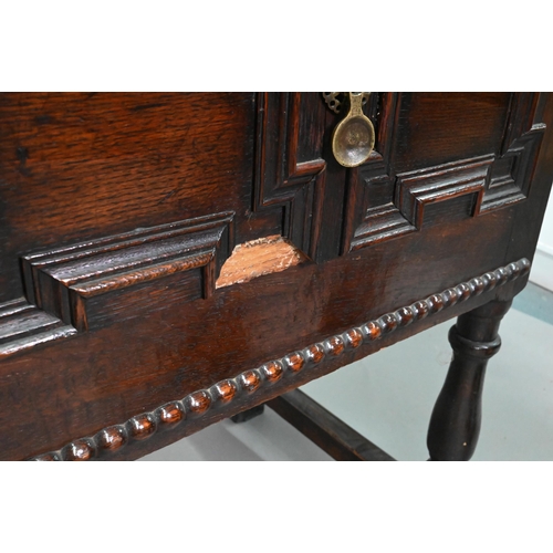 940 - An 18th century oak three low dresser, the single wide plank top over a trio of frieze drawers with ... 