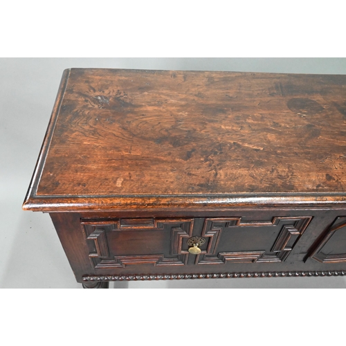 940 - An 18th century oak three low dresser, the single wide plank top over a trio of frieze drawers with ... 