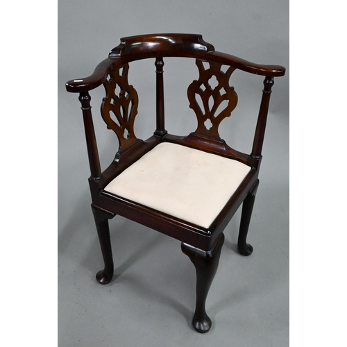 959 - A Georgian mahogany corner chair, with twin pierced vase shape splats flanked by turned pilasters, o... 