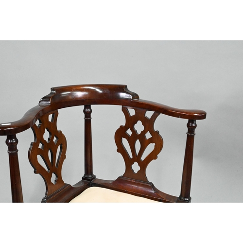 959 - A Georgian mahogany corner chair, with twin pierced vase shape splats flanked by turned pilasters, o... 