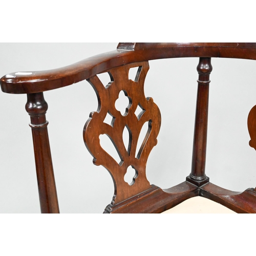 959 - A Georgian mahogany corner chair, with twin pierced vase shape splats flanked by turned pilasters, o... 