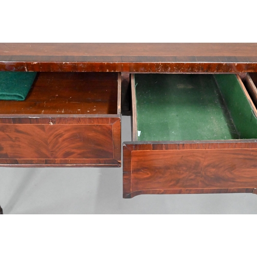 962 - A Victorian cross-banded mahogany bow-fronted serving table, with three frieze drawers, raised on sl... 