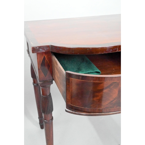 962 - A Victorian cross-banded mahogany bow-fronted serving table, with three frieze drawers, raised on sl... 