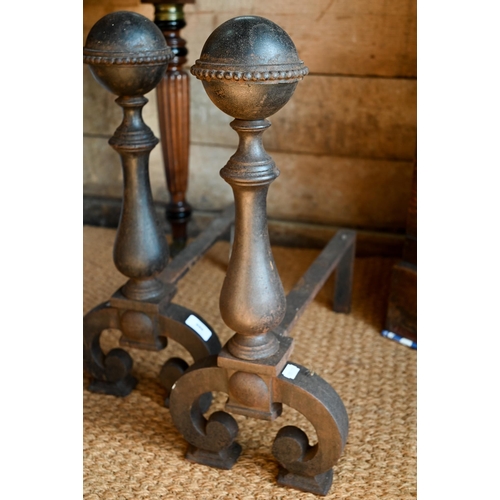 988 - A pair of 17th century style fire dogs, with antique/patinated finish with ball finials, 52 cm h (2)