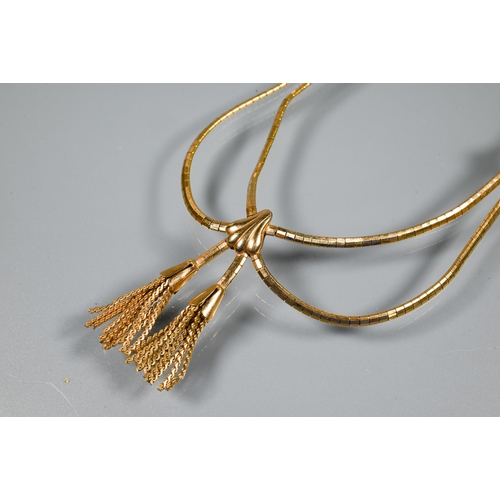 388 - A yellow metal necklace with box link chain and central tassels, bears stamp for 750 but untested, f... 