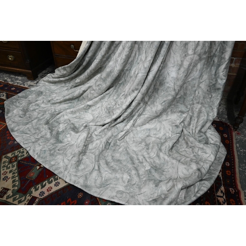 1210 - A pair of long country house curtains in pale grey with stylised acanthus leaf decoration, triple pl... 