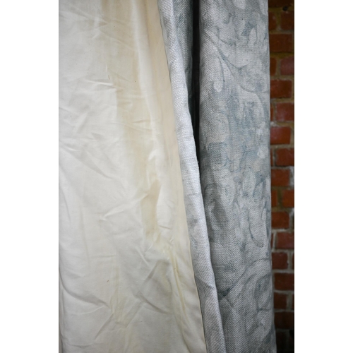 1210 - A pair of long country house curtains in pale grey with stylised acanthus leaf decoration, triple pl... 