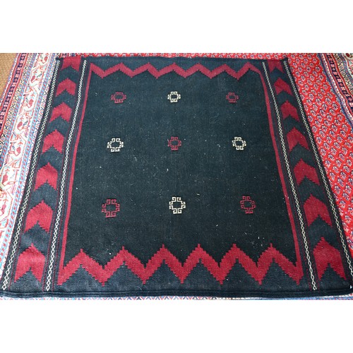 830A - A North East Persian Sofreh kelim, navy ground with red decoration, 134 x 133 cm