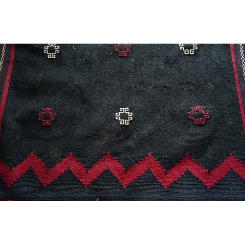 830A - A North East Persian Sofreh kelim, navy ground with red decoration, 134 x 133 cm