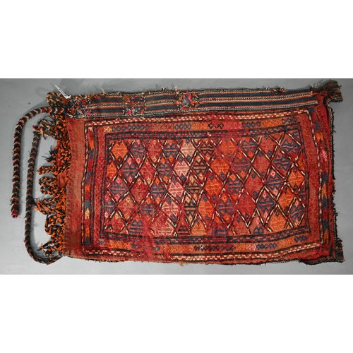 800 - An old Caucasian Sumak saddle/grain bag, with double sided geometric designs in multi-colours, 122 c... 