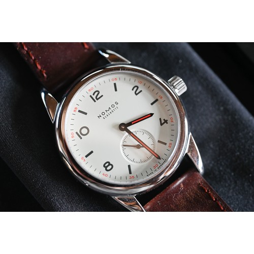 427 - A Nomos Club wristwatch - model 3564 with leather strap, boxed with documents, 2018