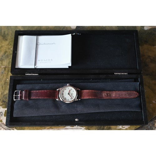 427 - A Nomos Club wristwatch - model 3564 with leather strap, boxed with documents, 2018