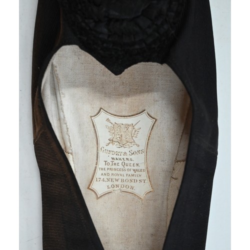 1087 - A pair of black silk stockings, the property of Queen Victoria, with drawn thread crowned 'VR' cyphe... 